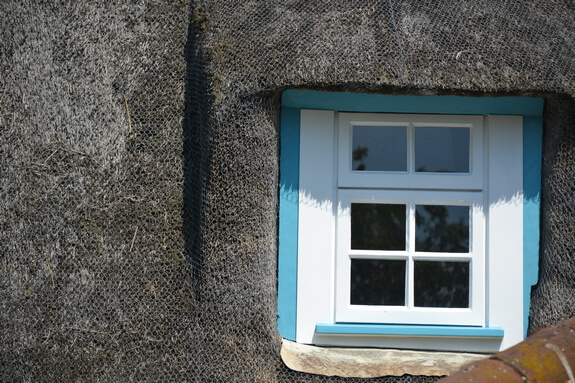 thatched roof cottage window 