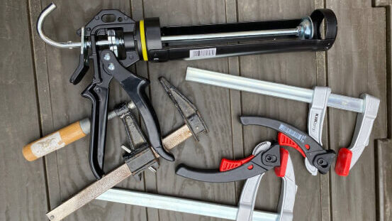 Clamps and sealant gun