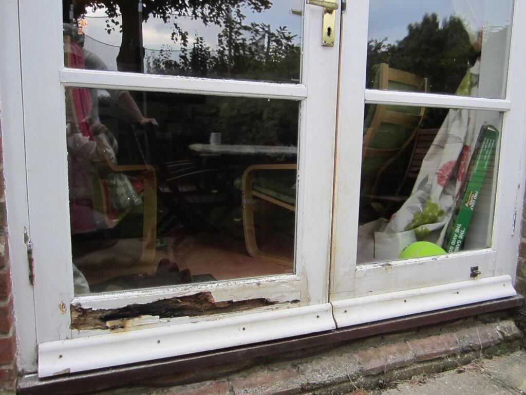 wooden patio door repair before