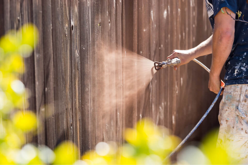 spraying a fence