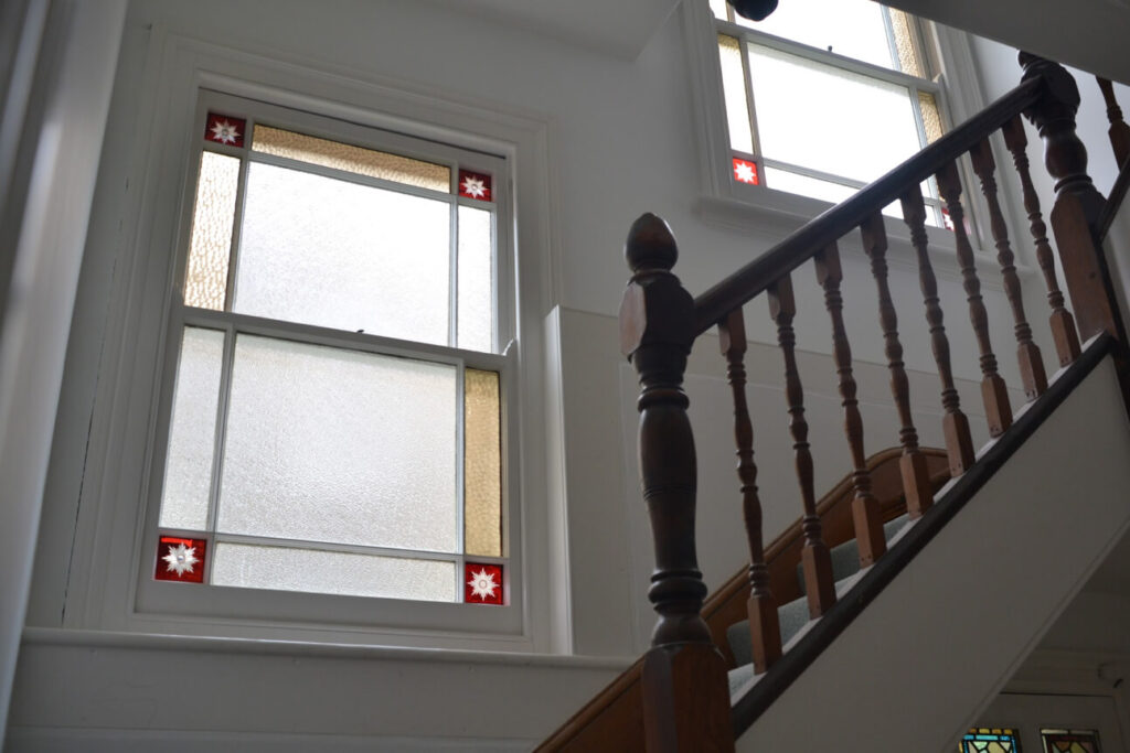 Marginal border sash windows with stained glass